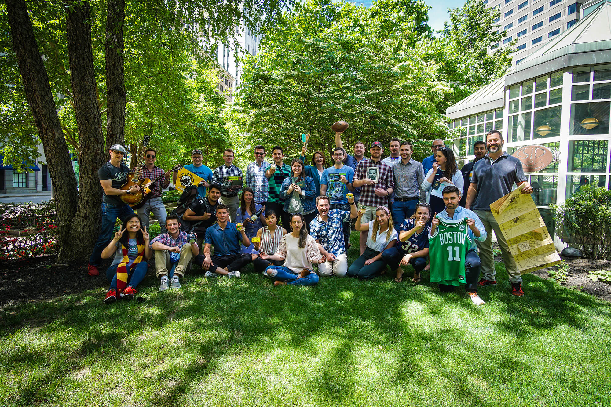 The Alyce team poses with objects that represent their personalities